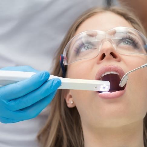 Dentist using intraoral camera to capture smile images