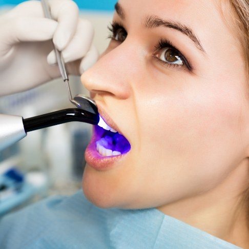 Woman receiving cosmetic dental bonding