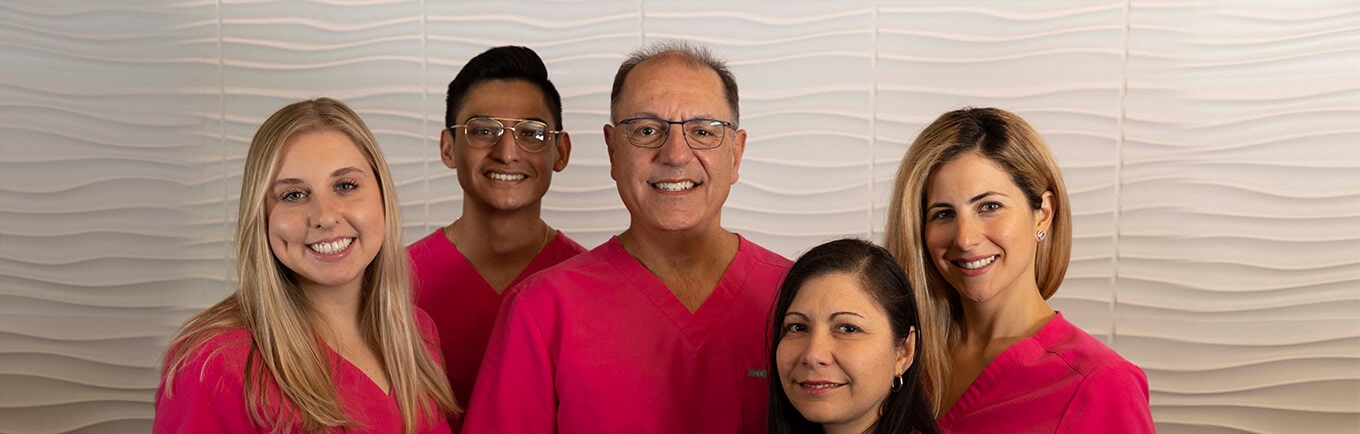 Doctor Mark Jacob and his dental team