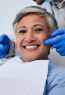 a patient smiling after a dental checkup near Highland Park