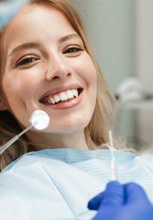 a patient smiling after receiving cosmetic dentistry near Highland Park