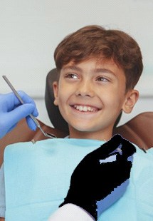 a child smiling after getting dental treatment